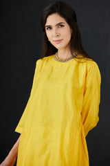 Perforated seam tunic with intricate hand embroidered Pants